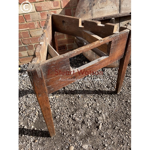 77 - An antique oak three legged cricket table