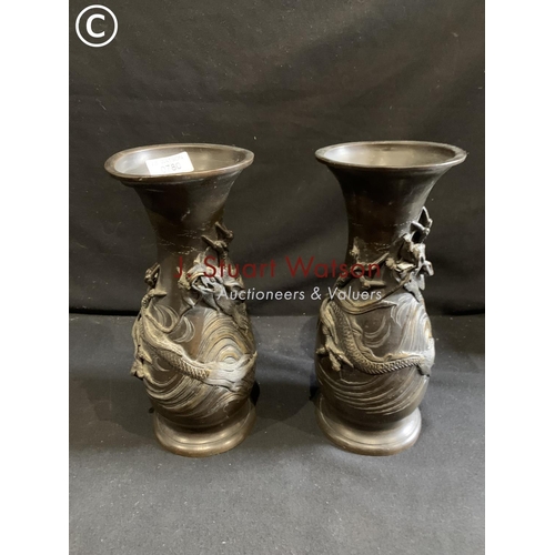 780 - Pair of Bronze vases height 28 cms, one lacking base