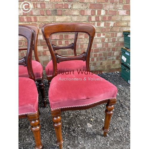 79 - A set of six Victorian mahogany balloon back chairs with red upholstered seats