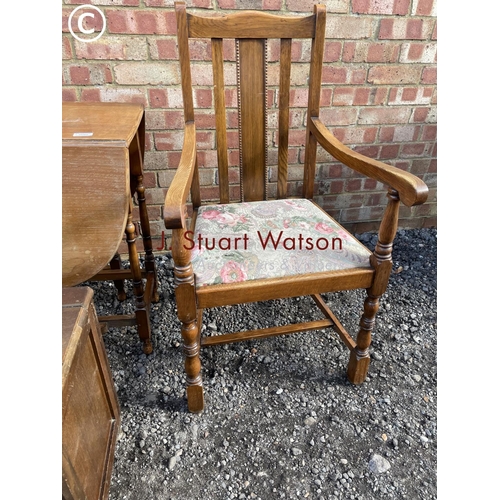 82 - An oak drop leaf table together with an oak carved and an oak blanket box