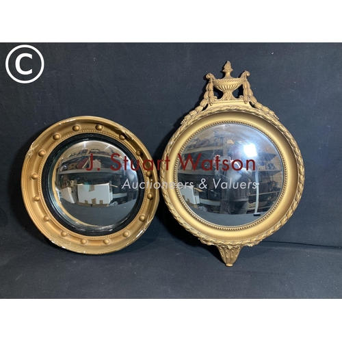 822 - Two gilt framed convex mirrors, largest 42 cms diameter