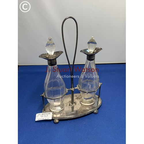 832 - Pair of cut glass oil and vinegar bottles with Silver mounts in Hallmarked Silver stand Chester   5.... 