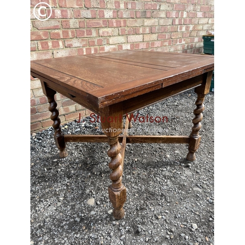 86 - An oak barley twist gate leg table