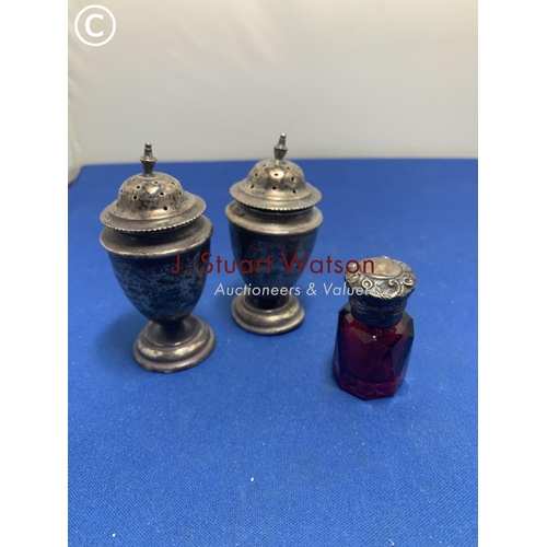 889 - Two Hallmarked Silver Pepper pots a/f weight 1.86 ozt and Silver topped Ruby glass Scent bottle