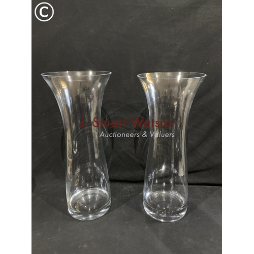 929 - Two tall glass vases height 60 cms diameter 25 cms