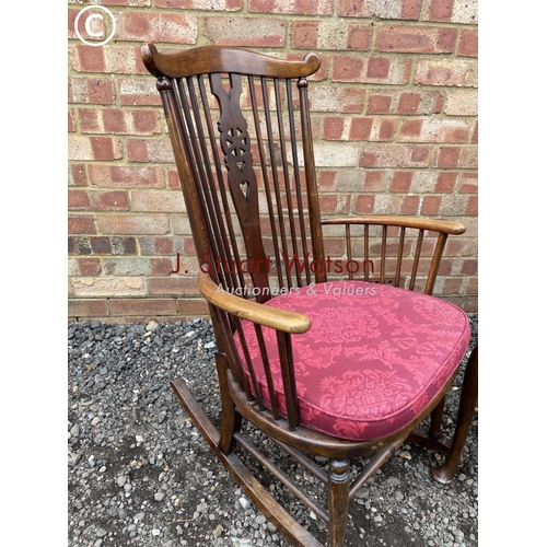 99 - A wheelback rocker together with another mahogany chair