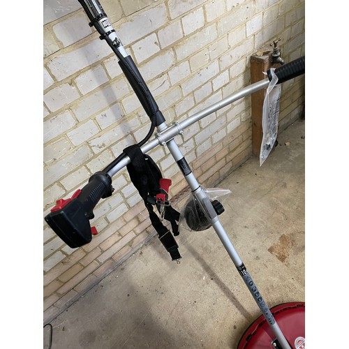 252 - An einhall petrol strimmer with 2 stroke oil in as new condition