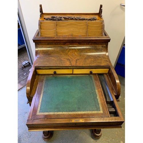 313 - A Victorian walnut pop top davenport with fitted interior and  four drawers and four dummy drawers.