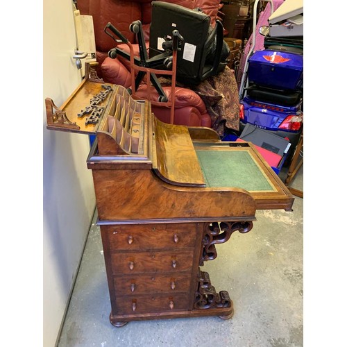 313 - A Victorian walnut pop top davenport with fitted interior and  four drawers and four dummy drawers.