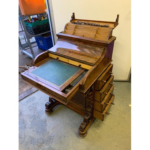 313 - A Victorian walnut pop top davenport with fitted interior and  four drawers and four dummy drawers.