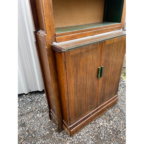 379 - A mid century oak bookcase cupboard