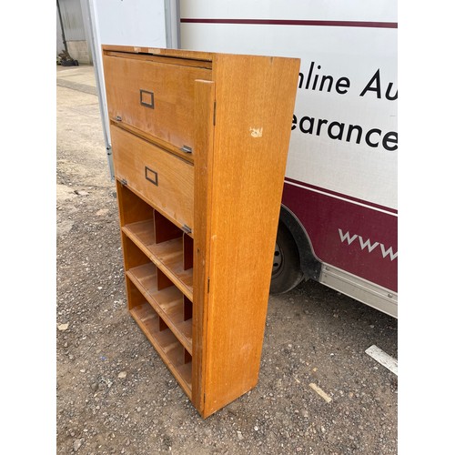 421 - An oak pigeon hole office cabinet with two up and over doors