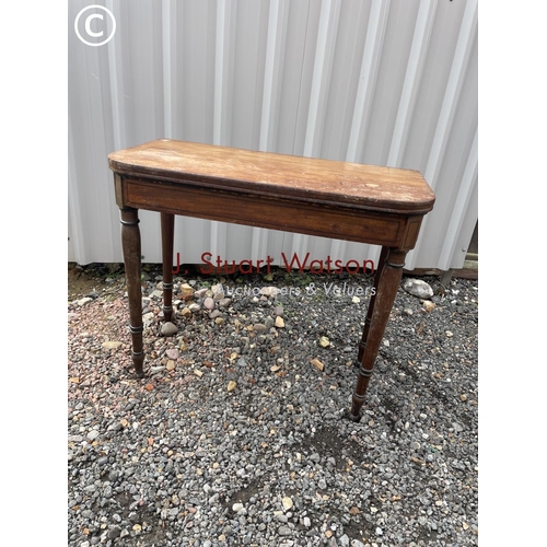 214 - A Victorian mahogany fold over card table