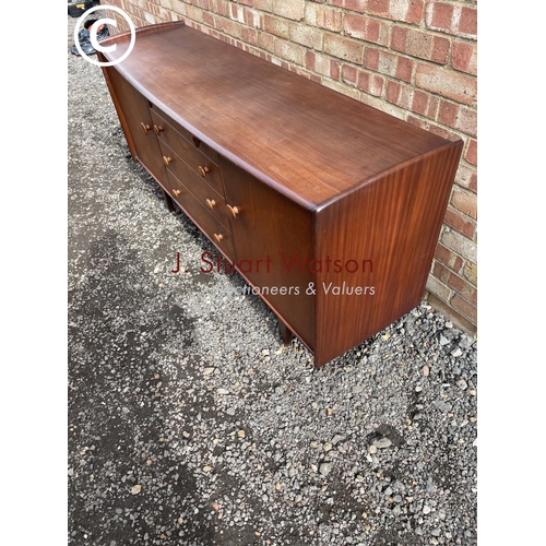 1 - A  Mid century teak sideboard labelled A Younger