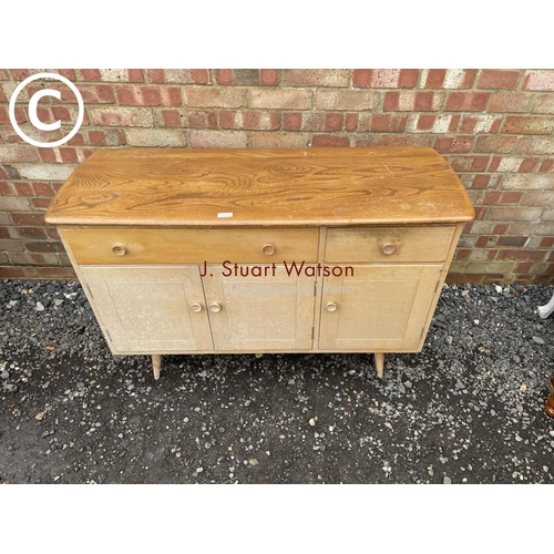 105 - An ercol style elm sideboard