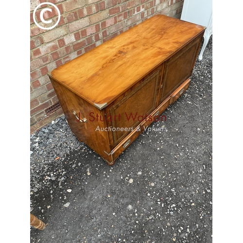 106 - A yew wood military style mule chest with two cupboard doors over three drawers