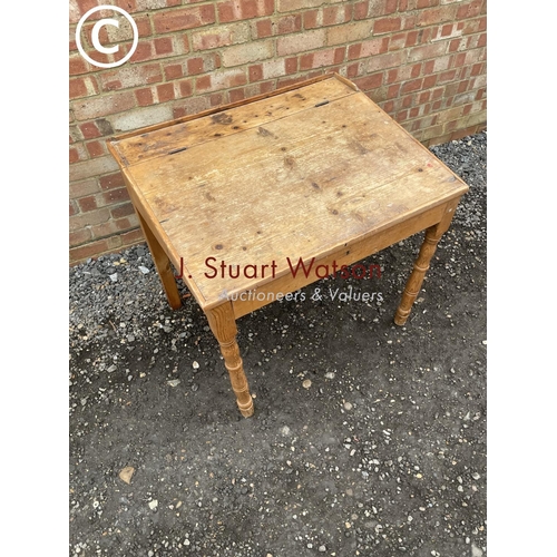 109 - A pine school style desk with lift up top