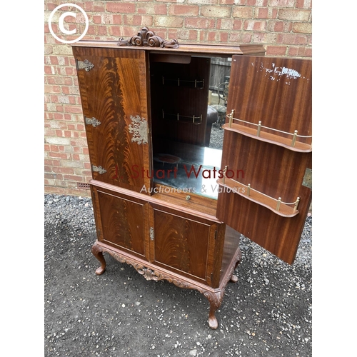 113 - A reproduction mahogany drinks cabinet