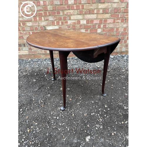 132 - A Georgian mahogany pad foot table