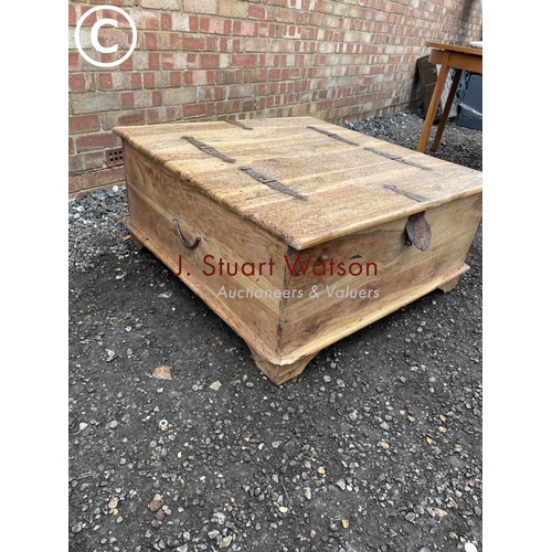 137 - A pine lift up ottoman coffee table