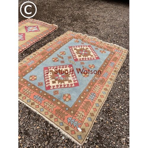 141 - Two Aztec pattern rugs larger larger 140x190