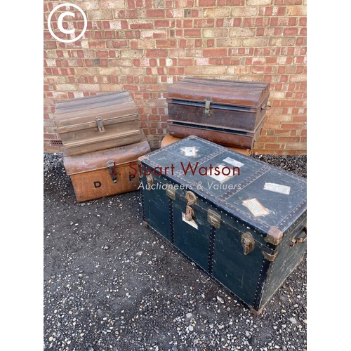 153 - Four vintage tin trunks together with a large green trunk