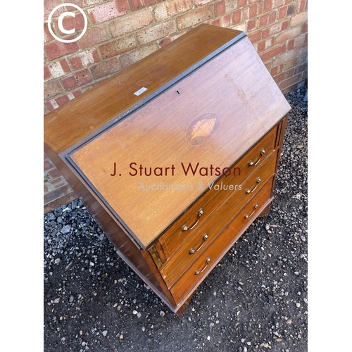 157 - An Edwardian mahogany bureau with a fitted interior