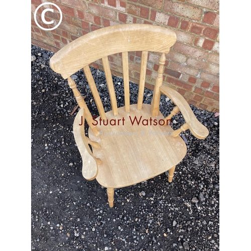 164 - A pine windsor style carver chair