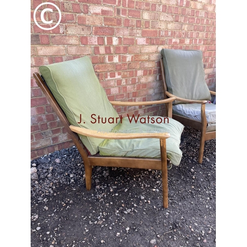 171 - A pair of mid century fireside chairs  by cintique