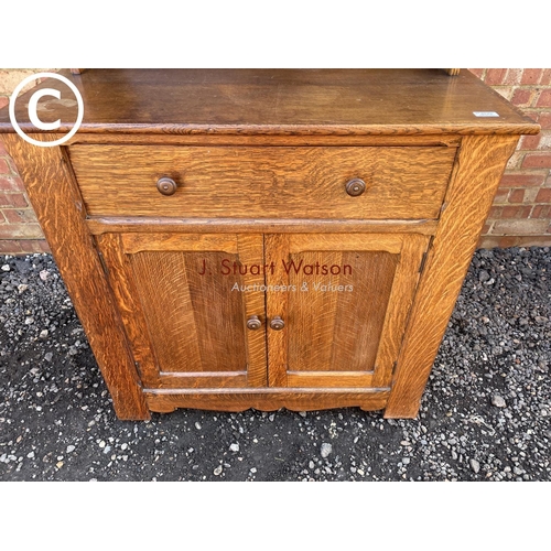 173 - An oak cottage style dresser 95cm wide