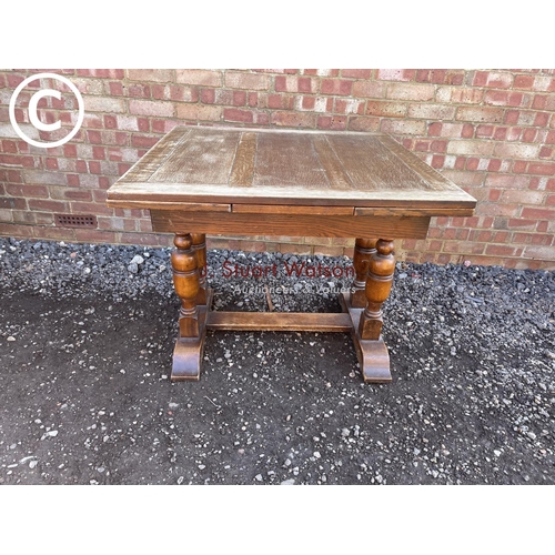 177 - An oak drawer leaf table