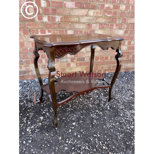 179 - An ornate mahogany occasional table