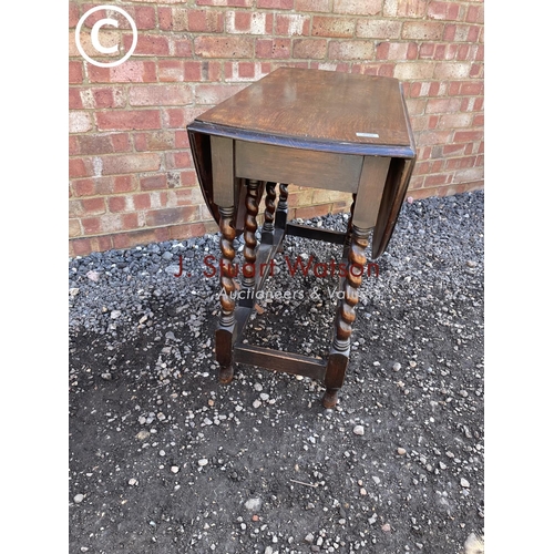 182 - An oak barley twist gateleg table