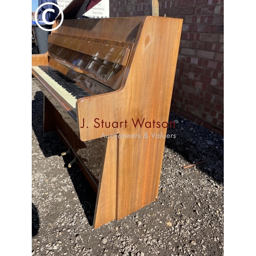 192 - A walnut cased upright piano 135 wide