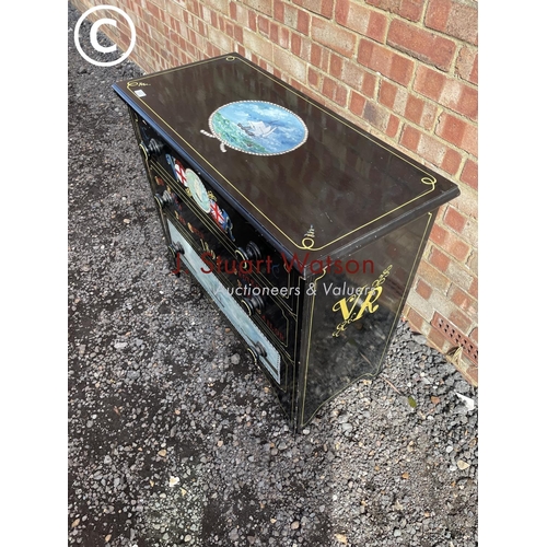 22 - A black painted chest of three drawers decorated with ship scenes