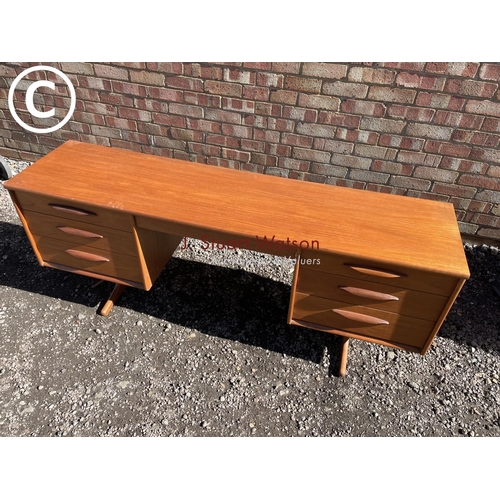 225 - A mid century teak g plan style six drawer writing desk 170x42 x40