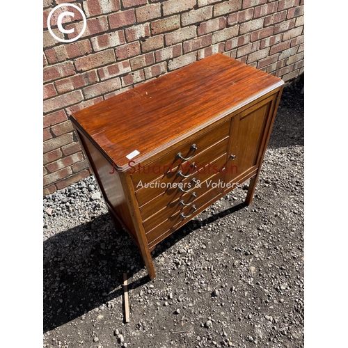 232 - An Edwardian mahogany music cabinet