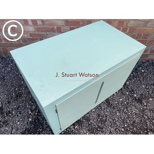 263 - A mint green painted ply cupboard