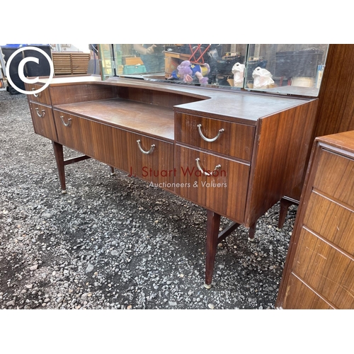 264 - A mid century teak three piece bedroom suite by meredew consisitng of a wardrobe, dressing table and... 