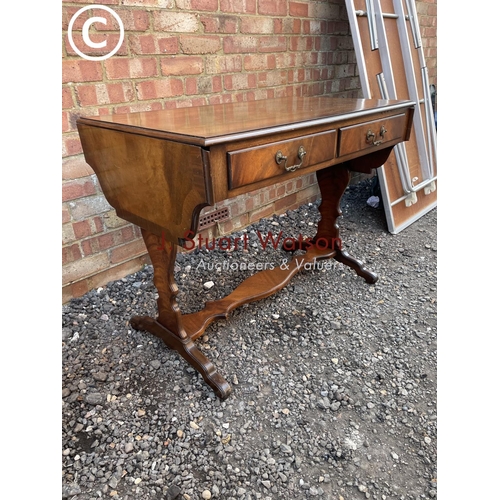 269 - A reproduction mahogany two drawer sofa table