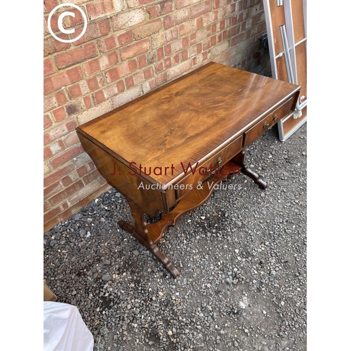 269 - A reproduction mahogany two drawer sofa table