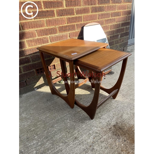 274 - A g plan teak nest of two tables together with a teak mirror