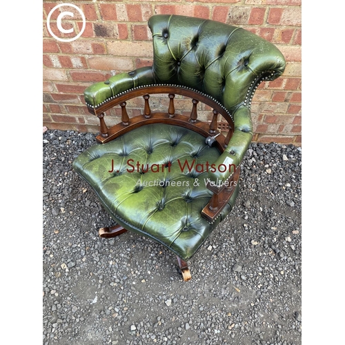 275 - A green leather chesterfield captains office chair