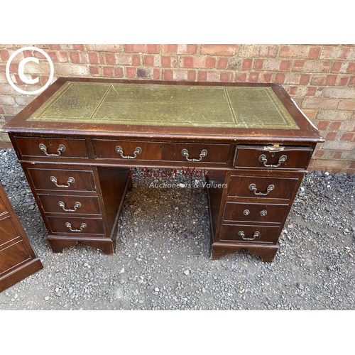 276 - A reproduction mahogany pedeatal desk together with a matching two drawer filing cabinet (loose hamd... 