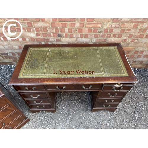 276 - A reproduction mahogany pedeatal desk together with a matching two drawer filing cabinet (loose hamd... 