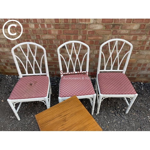 277 - Three white painted bamboo chairs together with a bedside