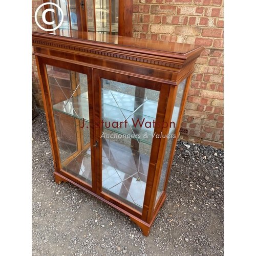 290 - A reproduction yew glazed display cabinet, together with matching two door corner cabinet