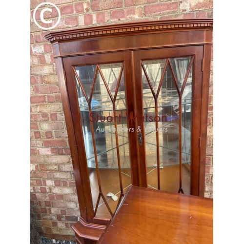 290 - A reproduction yew glazed display cabinet, together with matching two door corner cabinet