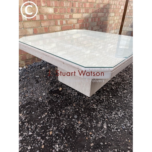 30 - A large modern limestone coffee table with glass top 100cm square