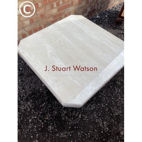 30 - A large modern limestone coffee table with glass top 100cm square